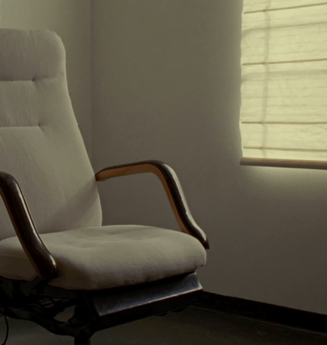 A consultation room with a treatment chair in daylight
