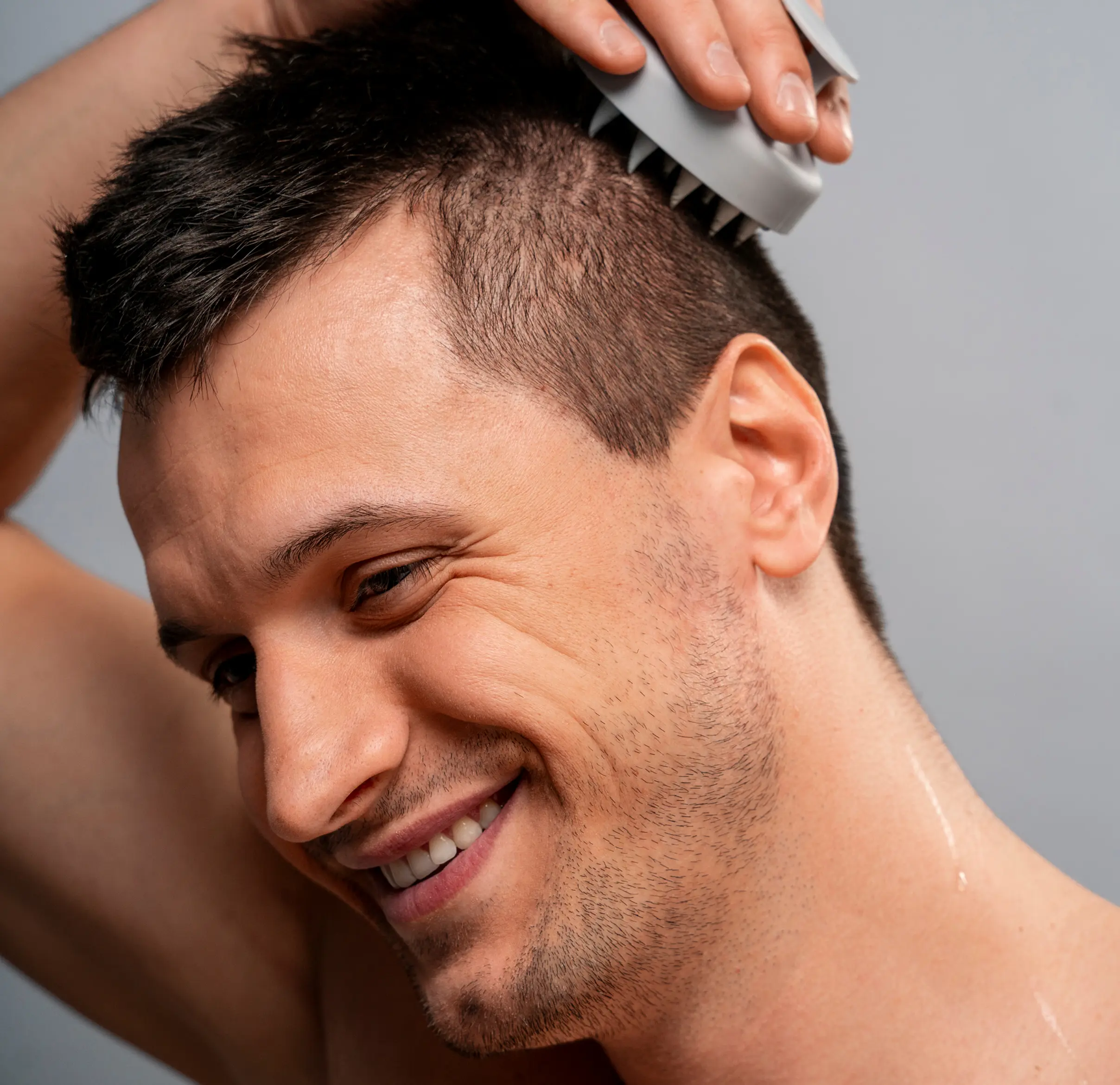 Man giving scalp massage.