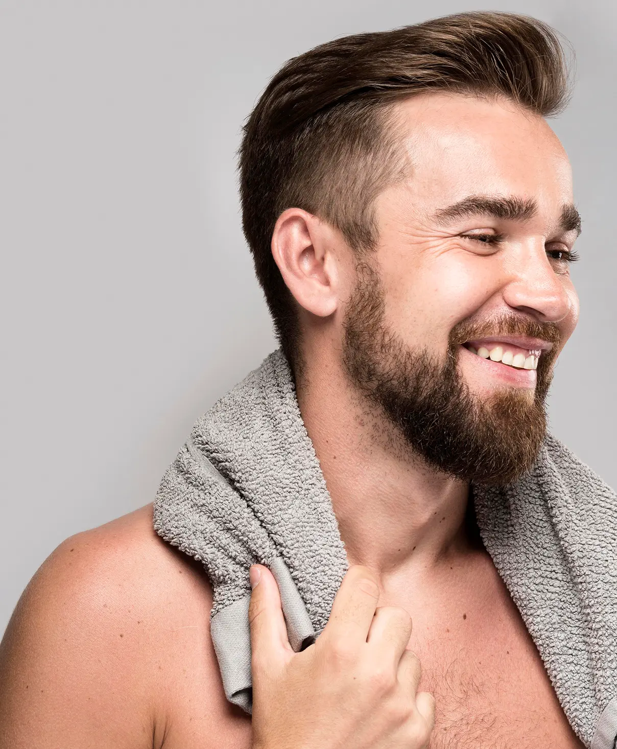 Handsome smiling shirtless man.